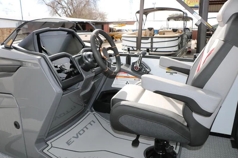 Slide: The Image of Interior of 2026 Evotti 723QL boat, featuring modern steering and comfortable seating. - 42