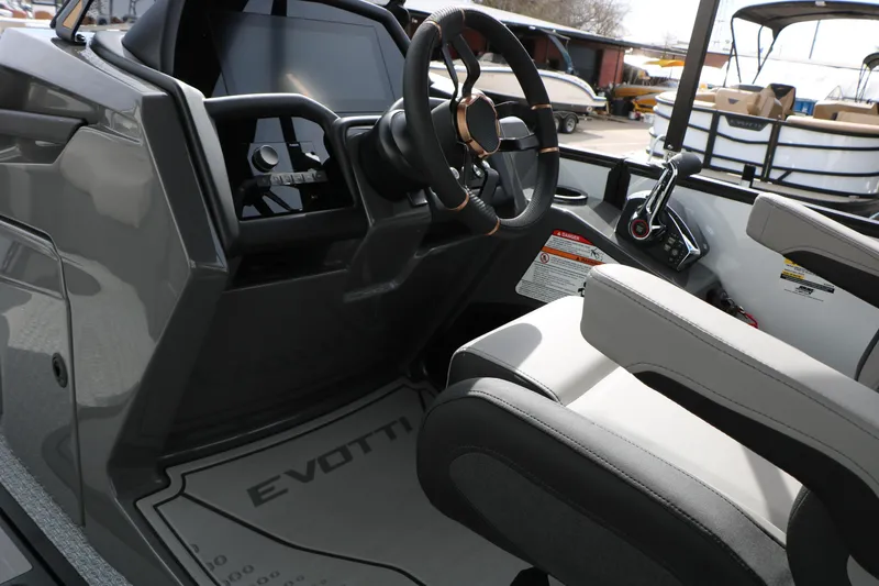 Slide: The Image of Interior of 2026 Evotti 723QL boat, featuring modern steering and control panel. - 48