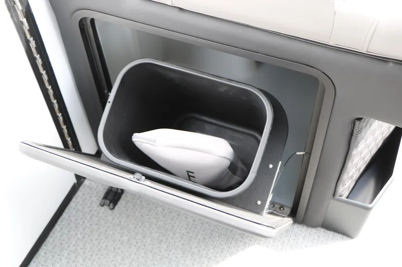 Slide: The Image of Storage compartment in 2026 Evotti 723QL, featuring a built-in bin with a cushion inside. - 51
