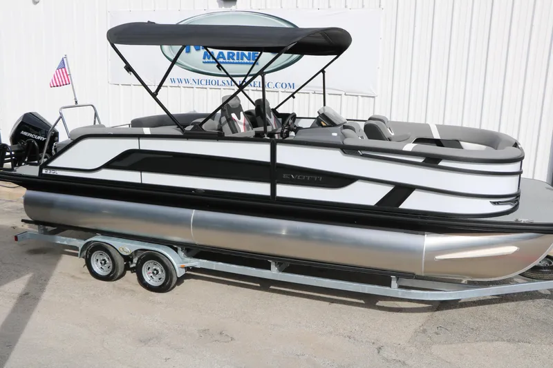 Slide: The Image of 2026 Evotti 723QL pontoon boat on trailer, sleek design, outdoor setting. - 15