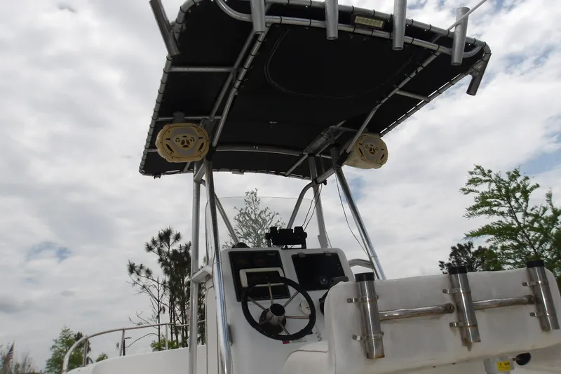 Slide: The Image of 2002 Seaswirl Striper 2101 Center Console O/B boat with T-top and steering wheel. - 7
