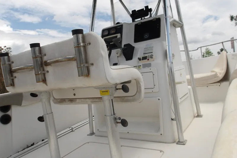 Slide: The Image of 2002 Seaswirl Striper 2101 Center Console O/B boat interior with seating and control panel. - 9