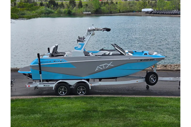The Image of 2023 ATX Surf Boats 20 Type-S on trailer by a lake. - 0