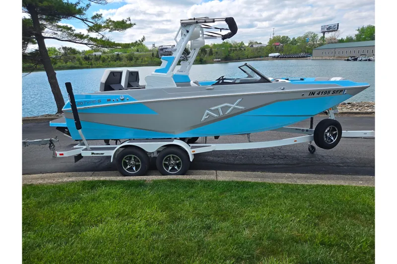 Slide: The Image of 2023 ATX Surf Boats 20 Type-S on trailer by a lake. - 10