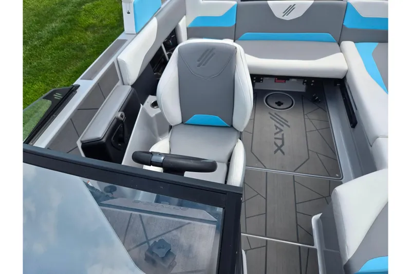 Slide: The Image of 2023 ATX Surf Boats 20 Type-S interior with gray and blue seating, modern design. - 23
