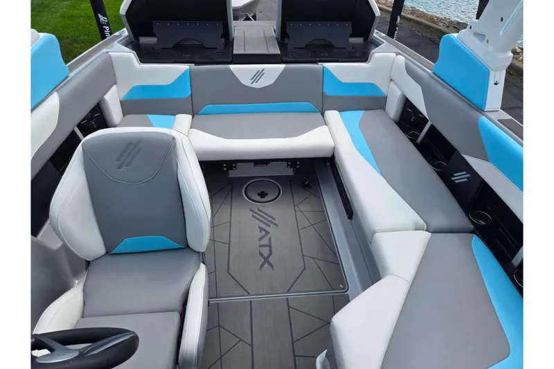 Slide: The Image of 2023 ATX Surf Boats 20 Type-S interior with gray and blue seating. - 24
