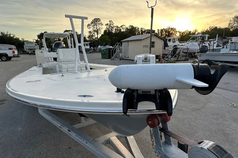 Slide: The Image of 2021 Beavertail Skiffs Vengeance boat on trailer at sunset in a marina. - 12