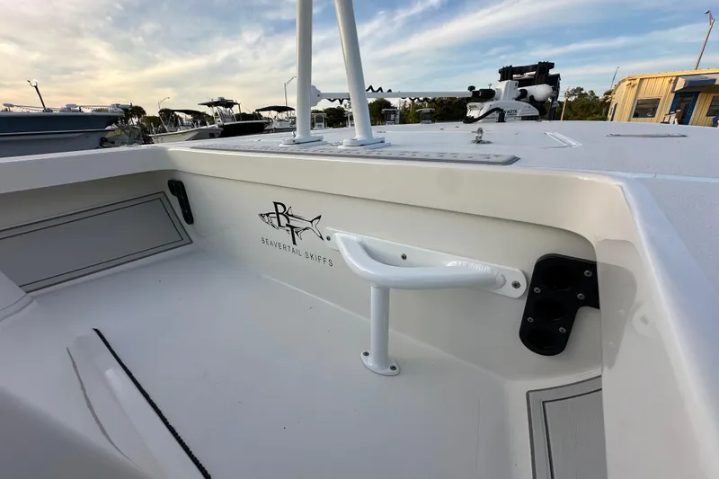 Slide: The Image of 2021 Beavertail Skiffs Vengeance boat interior with logo, showcasing sleek design and features. - 14