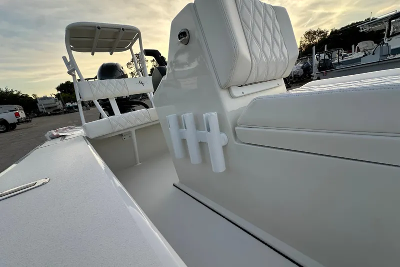 Slide: The Image of 2021 Beavertail Skiffs Vengeance boat interior with white seating and rod holders. - 15