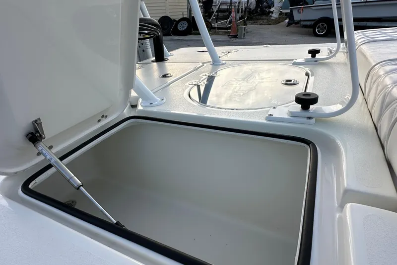 Slide: The Image of Open storage compartment on a 2021 Beavertail Skiffs Vengeance boat deck. - 16