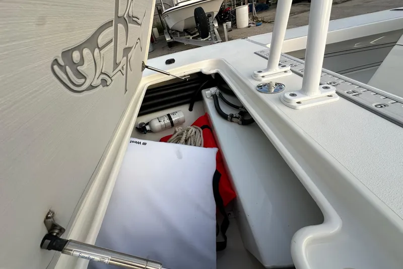 Slide: The Image of 2021 Beavertail Skiffs Vengeance storage compartment with fishing gear and accessories. - 20