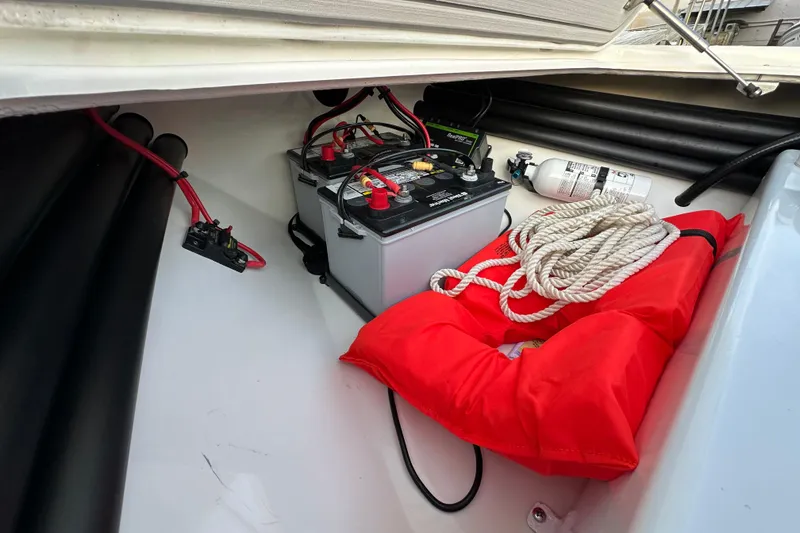 Slide: The Image of 2021 Beavertail Skiffs Vengeance storage with battery, life jacket, rope, and fire extinguisher. - 21