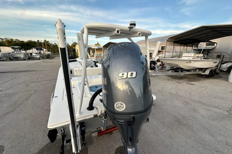 Slide: The Image of 2021 Beavertail Skiffs Vengeance with Yamaha 90 engine in a marina setting. - 22