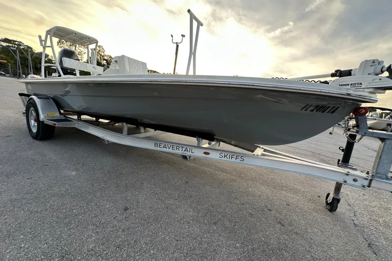 Slide: The Image of 2021 Beavertail Skiffs Vengeance boat on trailer, parked outdoors under cloudy sky. - 3