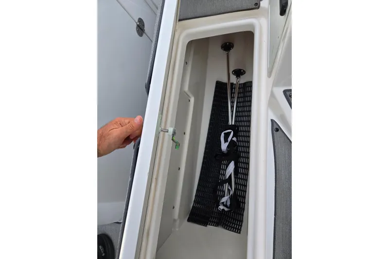Slide: The Image of Storage compartment in a 2021 Yamaha AR250 boat, showcasing interior features. - 15