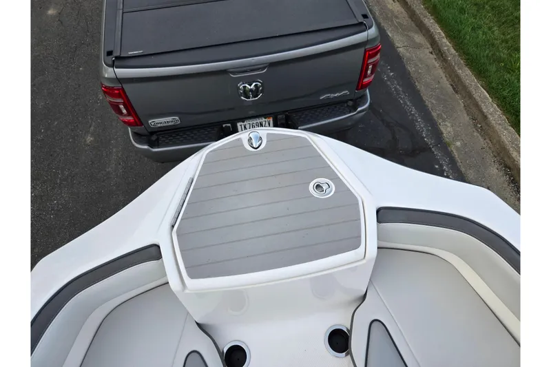 Slide: The Image of 2021 Yamaha AR250 boat bow near a parked gray pickup truck. - 17