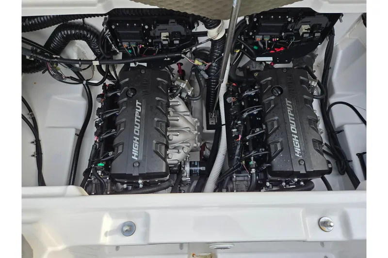 Slide: The Image of Engine compartment of a 2021 Yamaha Boats AR250, featuring dual high-output engines. - 23