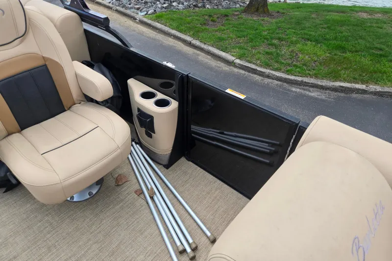 Slide: The Image of 2021 Barletta C22QC boat interior with beige seating and cup holders. - 13