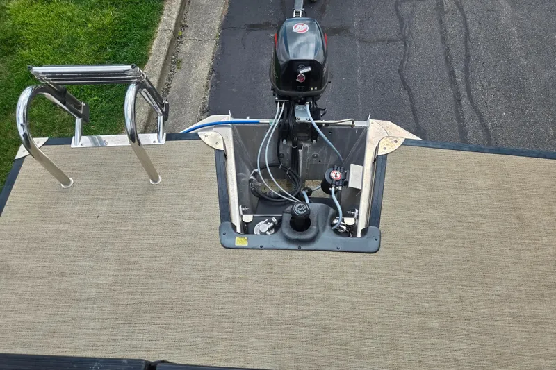 Slide: The Image of 2021 Barletta C22QC boat stern with motor and swim ladder. - 15