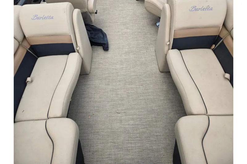 Slide: The Image of Interior of a 2021 Barletta C22QC pontoon boat with beige seating. - 16