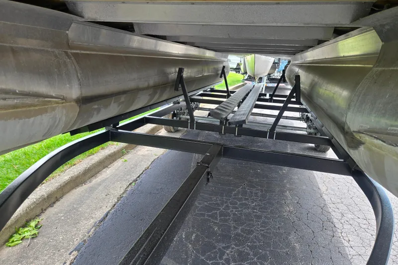 Slide: The Image of Underneath view of a 2021 Barletta C22QC pontoon boat on a trailer. - 7