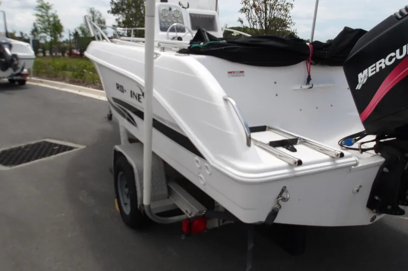 Slide: The Image of 2000 Pro-Line 19 Sport boat on trailer with Mercury outboard motor. - 5
