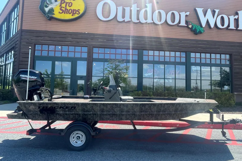 The Image of 2026 Tracker Grizzly 1860 CC boat on trailer outside Pro Shops Outdoor World. - 0