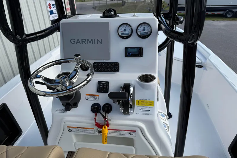 Slide: The Image of 2026 Blazer PureBay 2400 boat console with Garmin navigation and steering wheel. - 10