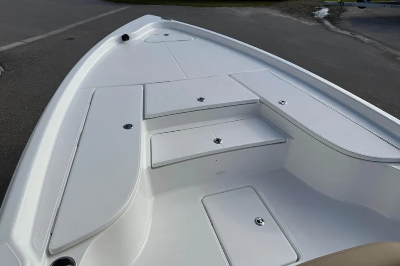 Slide: The Image of 2026 Blazer PureBay 2400 boat deck with storage compartments, showcasing sleek design. - 16