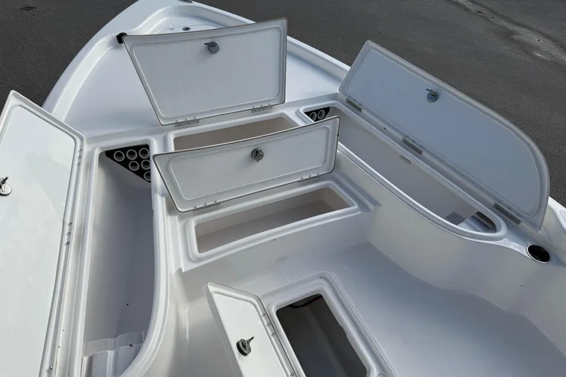 Slide: The Image of 2026 Blazer PureBay 2400 boat storage compartments open, showcasing ample space and organization. - 17