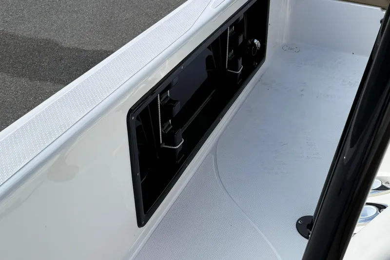 Slide: The Image of 2026 Blazer PureBay 2400 boat interior detail with sleek design and storage compartment. - 19