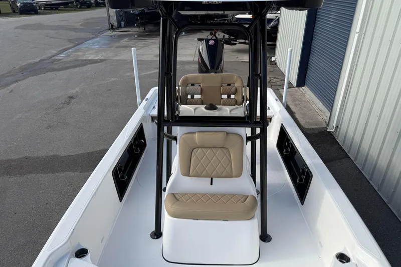 Slide: The Image of 2026 Blazer PureBay 2400 boat interior with tan seating and sleek design. - 20