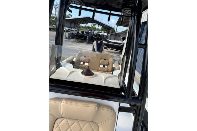 Slide: The Image of 2026 Blazer PureBay 2400 boat interior with tan seating and sleek design. - 21