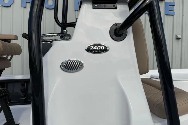 Slide: The Image of 2026 Blazer PureBay 2400 boat console with steering wheel and seating detail. - 3