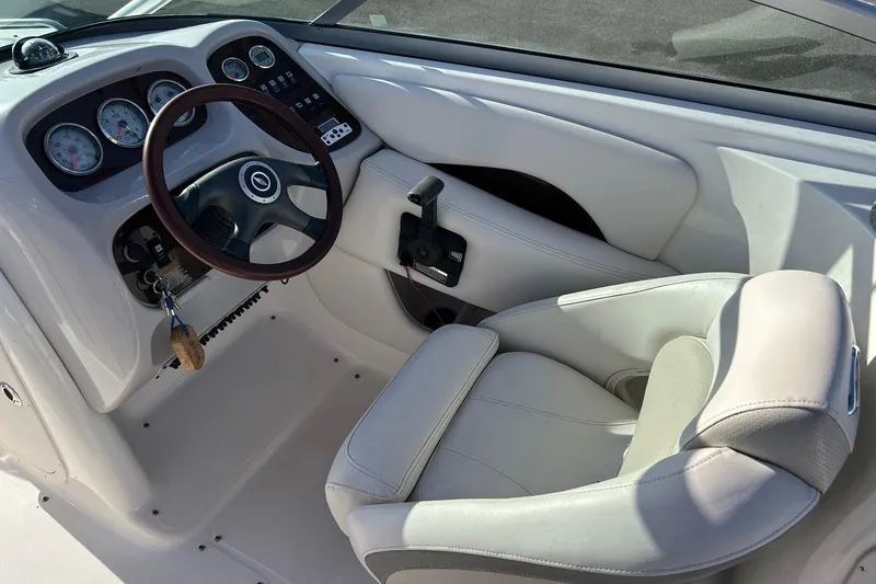 Slide: The Image of 2007 Chaparral 246 SSi boat cockpit with steering wheel and gauges. - 12