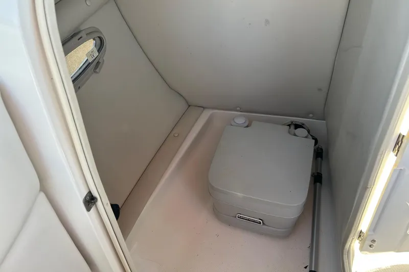 Slide: The Image of Interior of a 2007 Chaparral 246 SSi boat with portable toilet. - 15