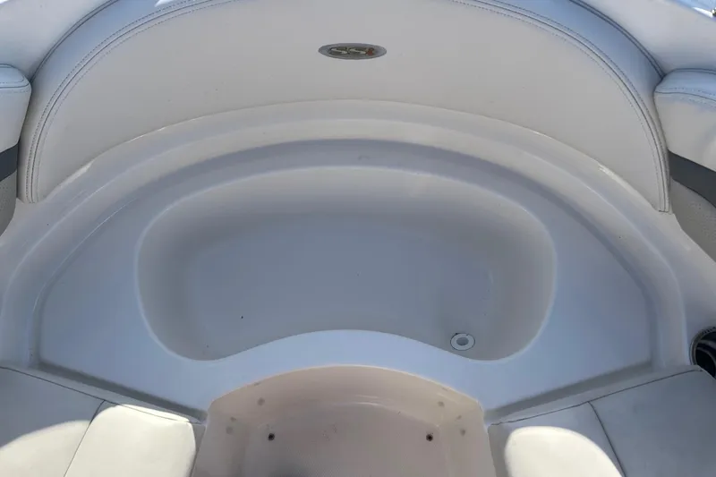 Slide: The Image of 2007 Chaparral 246 SSi boat interior seating area, white upholstery, clean design. - 19