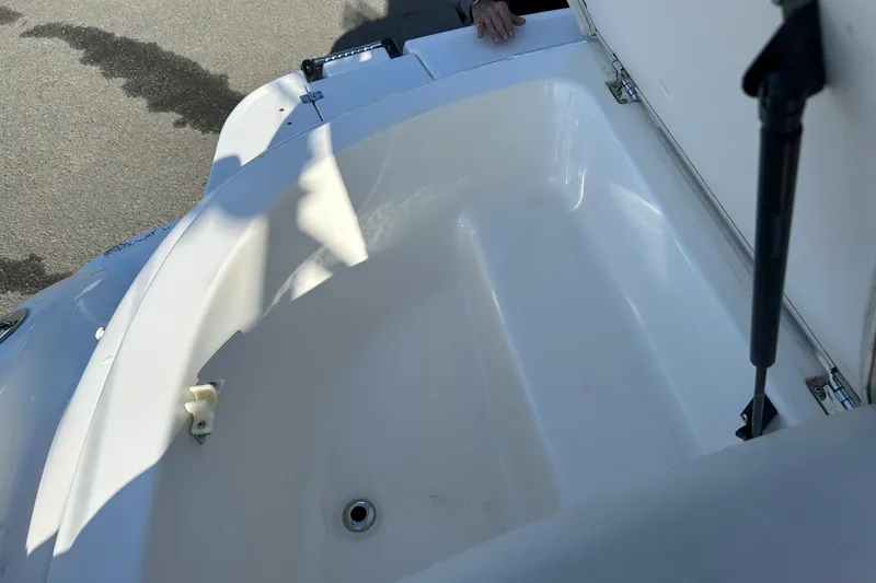 Slide: The Image of Open storage compartment on a 2007 Chaparral 246 SSi boat. - 20