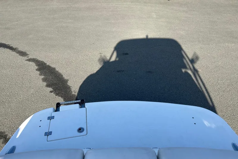 Slide: The Image of Shadow of Chaparral 246 SSi boat on pavement, 2007 model, with visible deck details. - 21