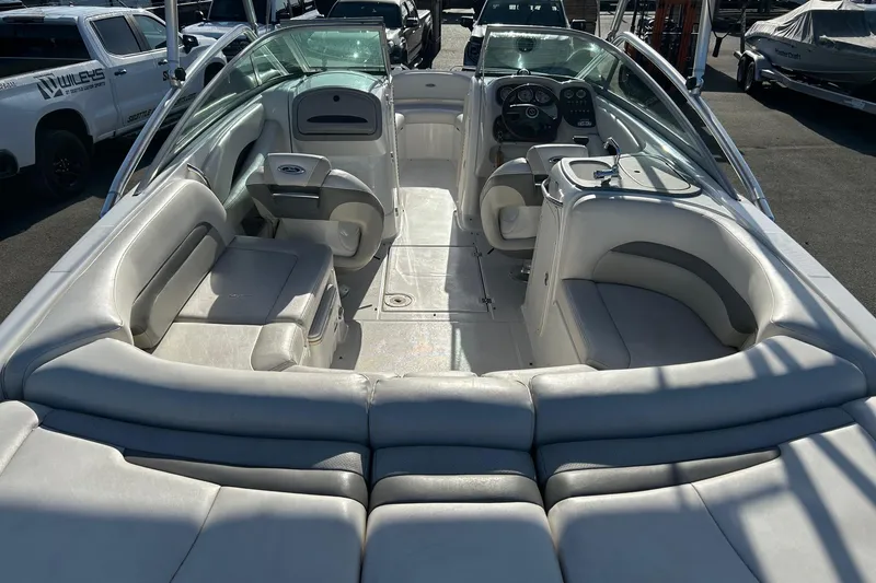 Slide: The Image of Interior view of a 2007 Chaparral 246 SSi boat with spacious seating and modern dashboard. - 6