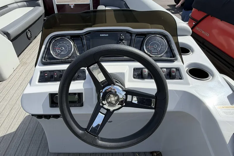 Slide: The Image of Steering console of 2022 Godfrey Sweetwater 2286 C pontoon boat with gauges and controls. - 13