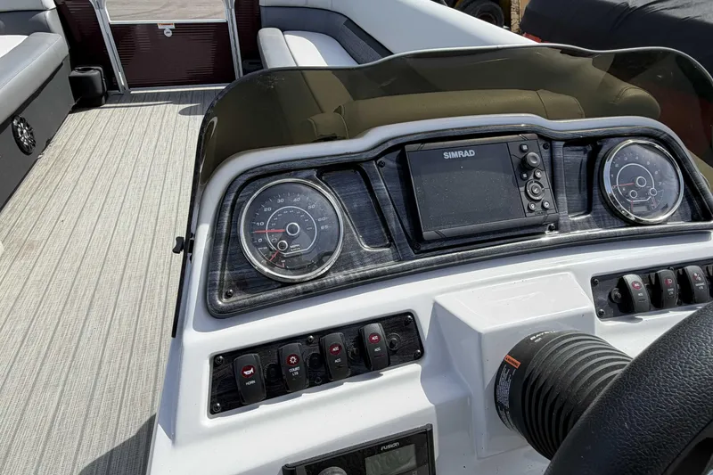 Slide: The Image of Dashboard of 2022 Godfrey Sweetwater 2286 C boat with gauges and controls. - 15