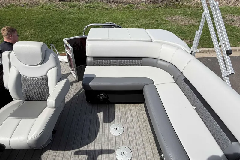 Slide: The Image of 2022 Godfrey Sweetwater 2286 C boat interior with gray and white seating. - 16