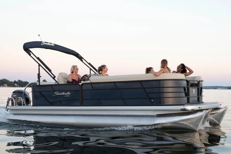 Slide: The Image of Manufacturer Provided Image: 2022 Godfrey Sweetwater 2286 C pontoon boat with passengers enjoying a sunset cruise. - 20