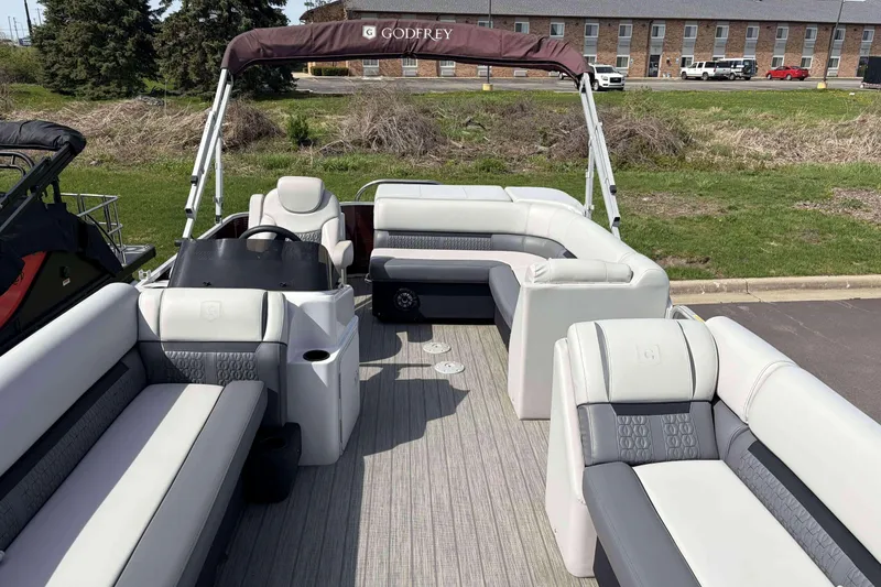 Slide: The Image of 2022 Godfrey Sweetwater 2286 C pontoon boat with spacious seating and canopy. - 3