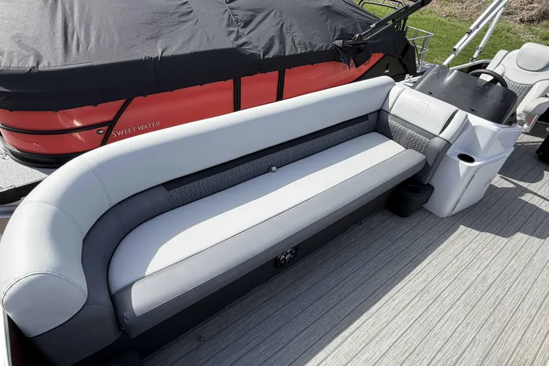 Slide: The Image of 2022 Godfrey Sweetwater 2286 C pontoon boat with gray seating and covered deck. - 5