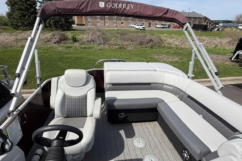 Slide: The Image of Interior of 2022 Godfrey Sweetwater 2286 C pontoon boat with seating and steering wheel. - 9