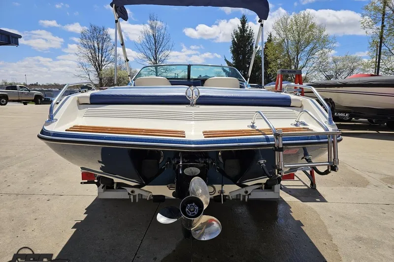 Slide: The Image of 1988 Glastron/Carlson CVX-23 boat, rear view, parked outdoors on a sunny day. - 27
