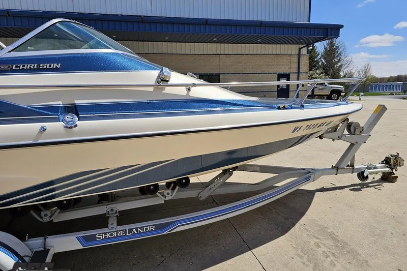Slide: The Image of 1988 Glastron/Carlson CVX-23 boat on ShoreLand'r trailer, parked outdoors. - 3