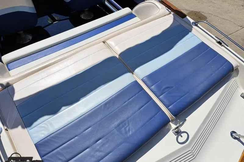 Slide: The Image of 1988 Glastron/Carlson CVX-23 boat with blue and white seating upholstery. - 34